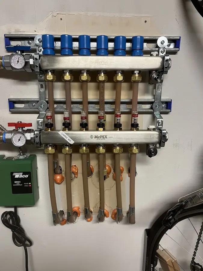 Plumber performing Water Heater Repair at a residential property in Woodlawn